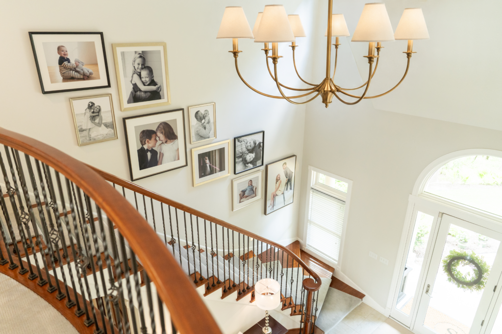 View from upstairs looking at family wall gallery on stairway.