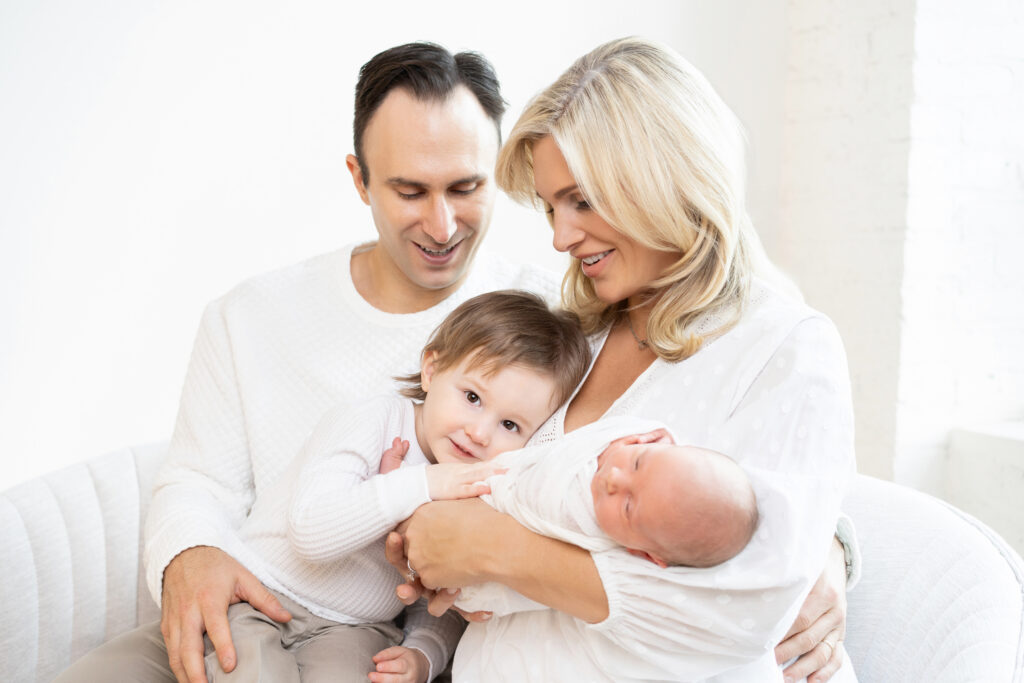 loving family photos with newborn and toddler